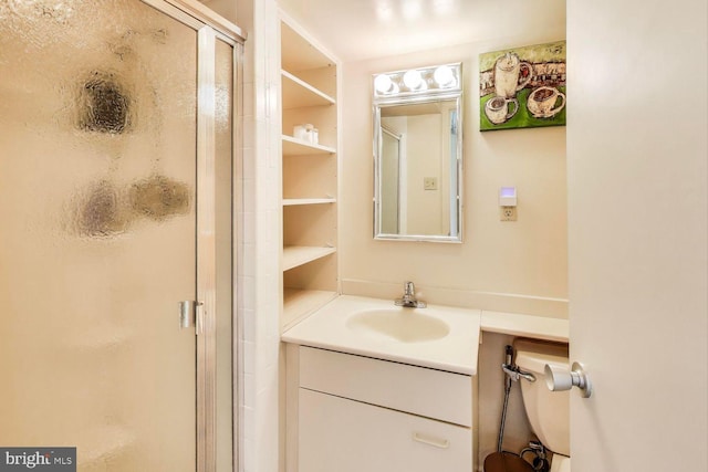 bathroom with a stall shower and vanity