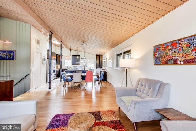 living room featuring wood ceiling, visible vents, vaulted ceiling, and light wood-style flooring