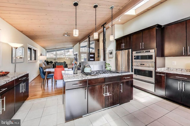 kitchen with light tile patterned floors, stainless steel appliances, hanging light fixtures, lofted ceiling with skylight, and wood ceiling