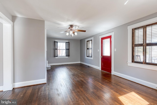 entryway with baseboards, wood-type flooring, and ceiling fan