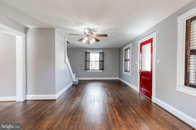 entryway with hardwood / wood-style floors, a ceiling fan, and baseboards