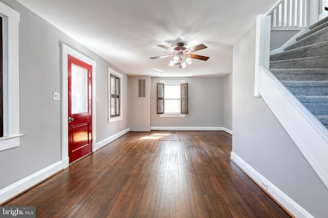 entrance foyer featuring stairs, dark wood-style floors, baseboards, and ceiling fan