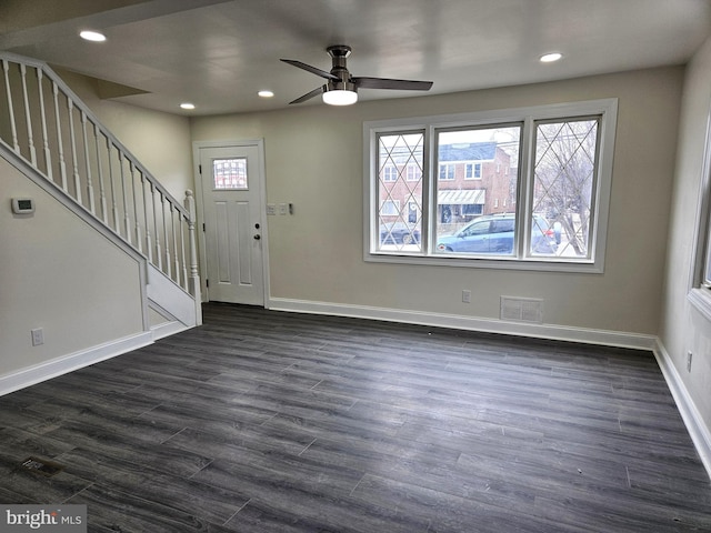 entryway featuring dark wood-type flooring, stairway, recessed lighting, and baseboards