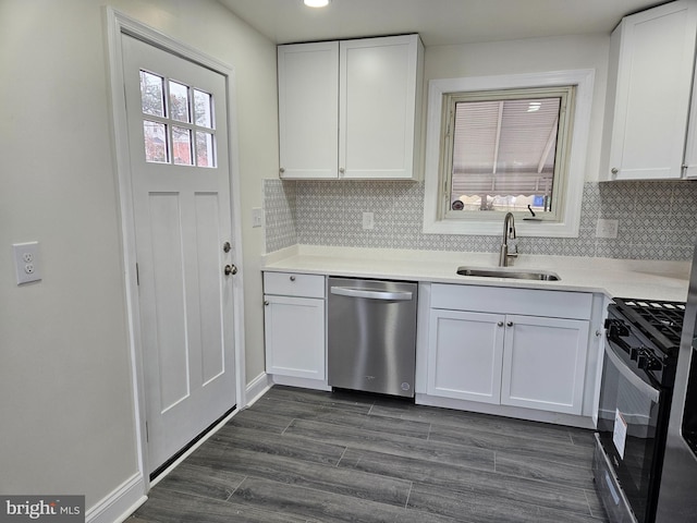 kitchen with light countertops, range with gas cooktop, white cabinets, and dishwasher