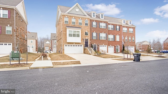 townhome / multi-family property featuring central AC unit, a garage, brick siding, concrete driveway, and a residential view