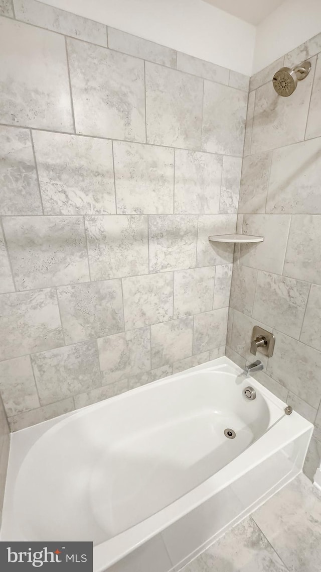 bathroom with shower / tub combination