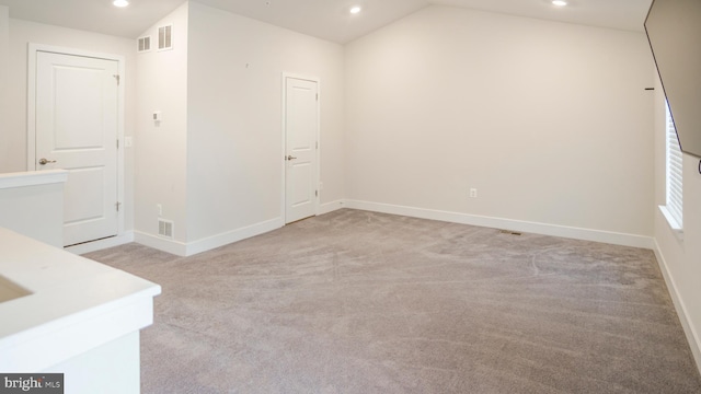 empty room featuring baseboards and recessed lighting