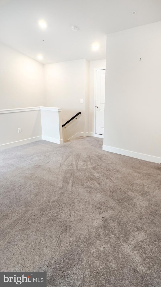 carpeted spare room with recessed lighting and baseboards