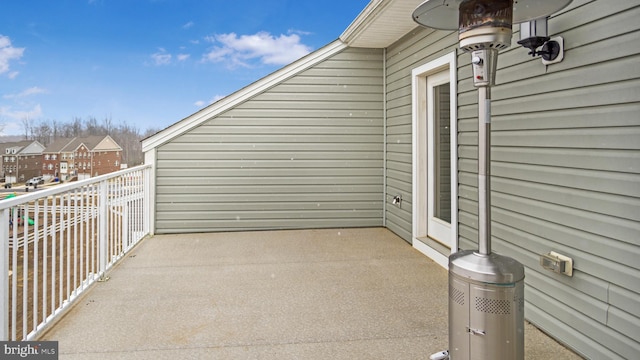 view of patio with a residential view and a balcony