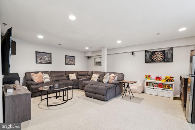 living area with light carpet and recessed lighting