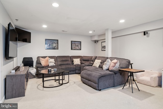 living room with recessed lighting and light colored carpet