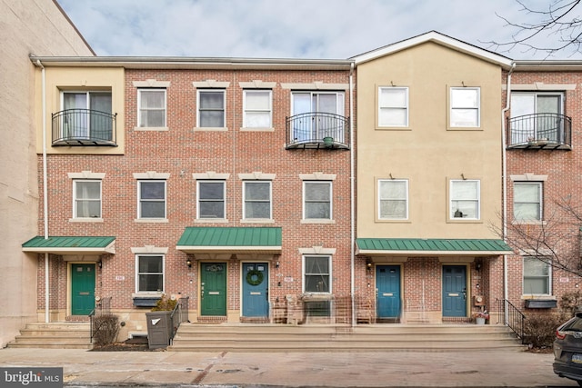 multi unit property featuring brick siding