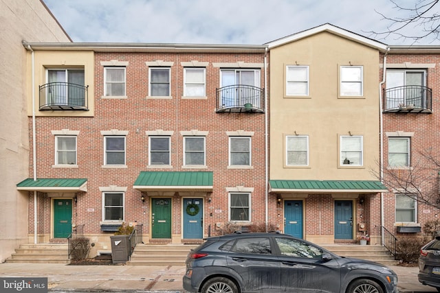 view of property featuring brick siding