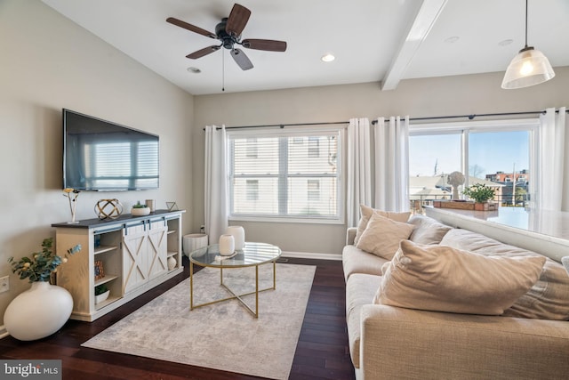 living room with beam ceiling, a ceiling fan, dark wood finished floors, recessed lighting, and baseboards