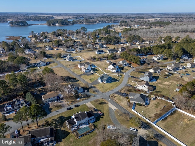 drone / aerial view with a water view and a residential view