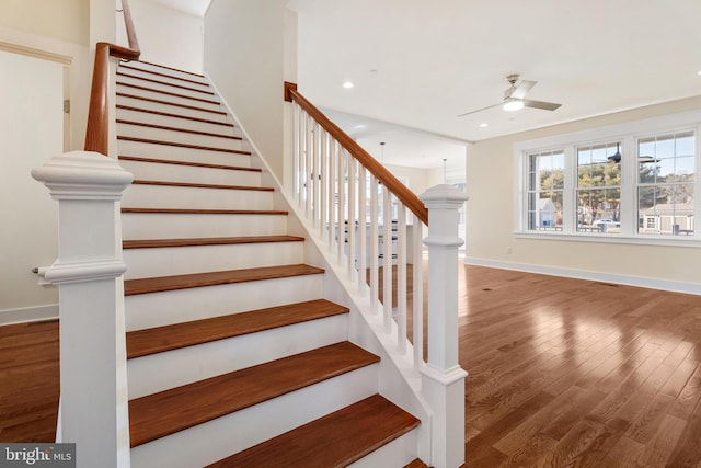 stairs with a ceiling fan, baseboards, wood finished floors, and recessed lighting