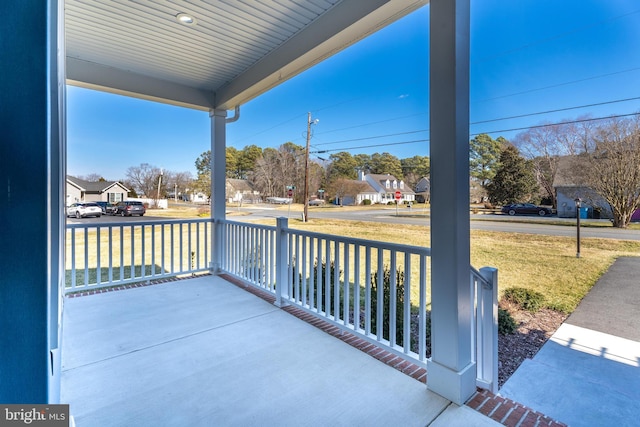 view of patio with covered porch and a residential view