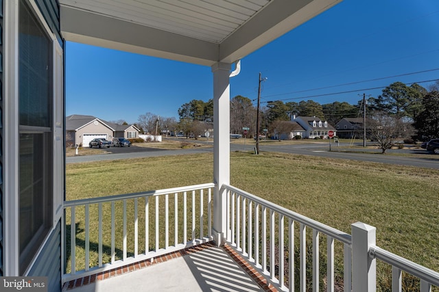 balcony with a residential view and covered porch