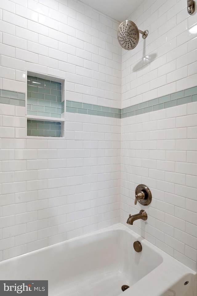 bathroom with shower / washtub combination