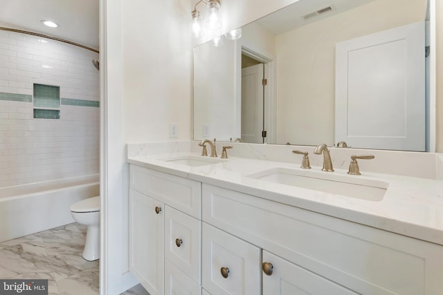 bathroom featuring marble finish floor, visible vents, a sink, and toilet