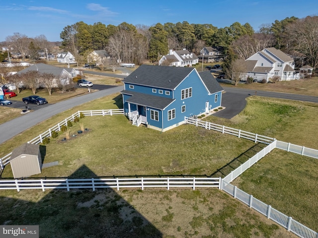 birds eye view of property with a residential view