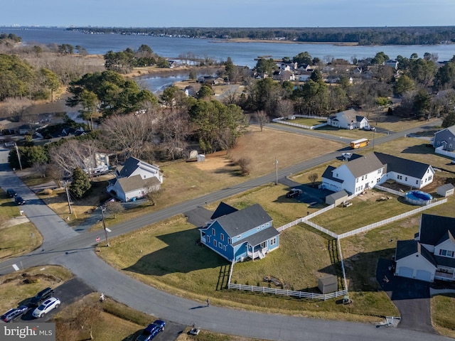 drone / aerial view featuring a water view and a residential view