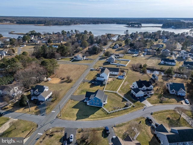 bird's eye view with a water view and a residential view