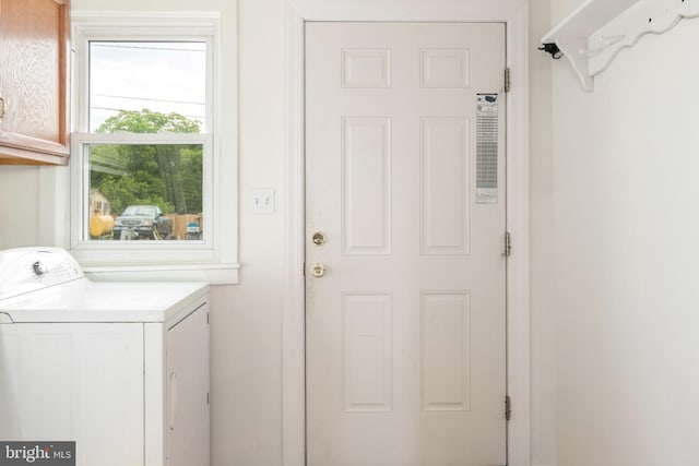 201 Washington St, Cambridge, MD 21613 - laundry area featuring washer / dryer and cabinet space