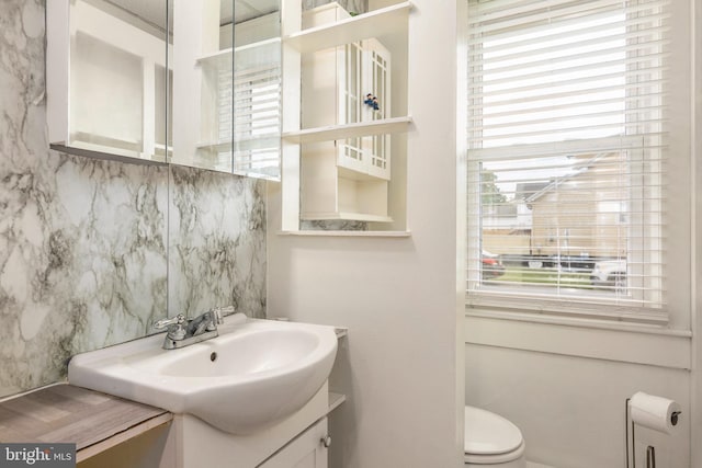 201 Washington St, Cambridge, MD 21613 - bathroom with vanity and backsplash
