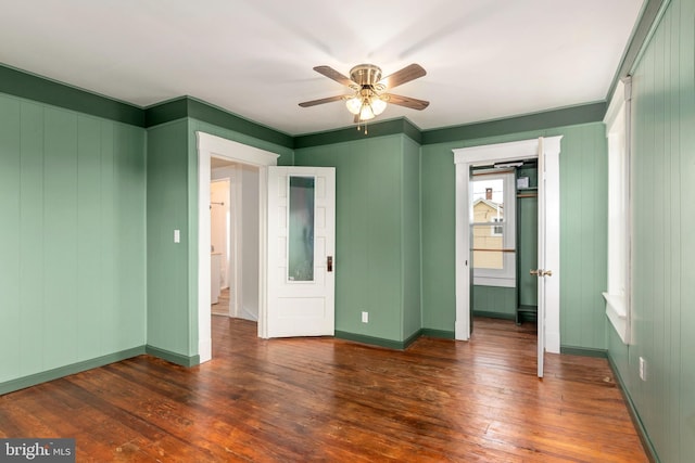201 Washington St, Cambridge, MD 21613 - unfurnished bedroom featuring dark wood finished floors and ceiling fan