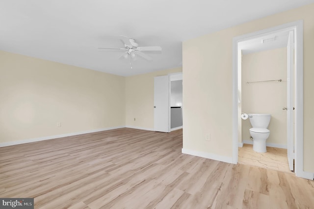 interior space with ceiling fan, light wood-style flooring, and baseboards