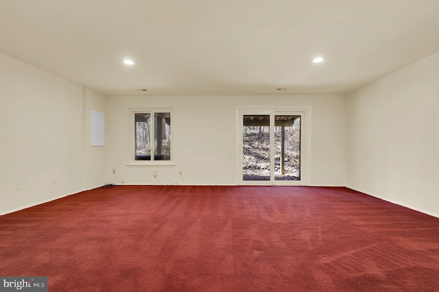 carpeted empty room with recessed lighting and visible vents