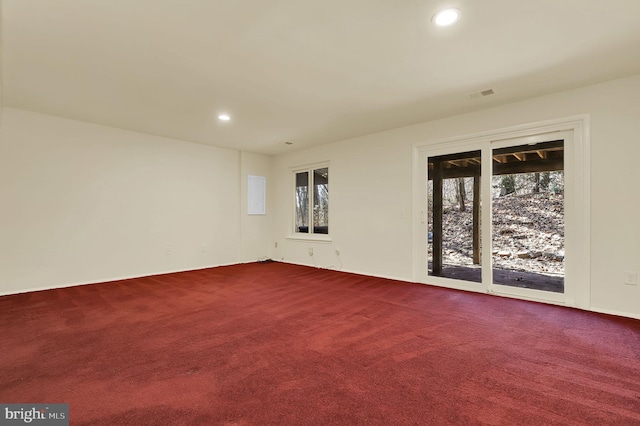 unfurnished room featuring recessed lighting, visible vents, and dark carpet