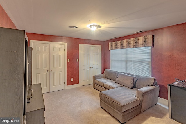 2 Wilderness Dr, Medford, NJ 08055 - living room featuring light colored carpet, baseboards, and visible vents
