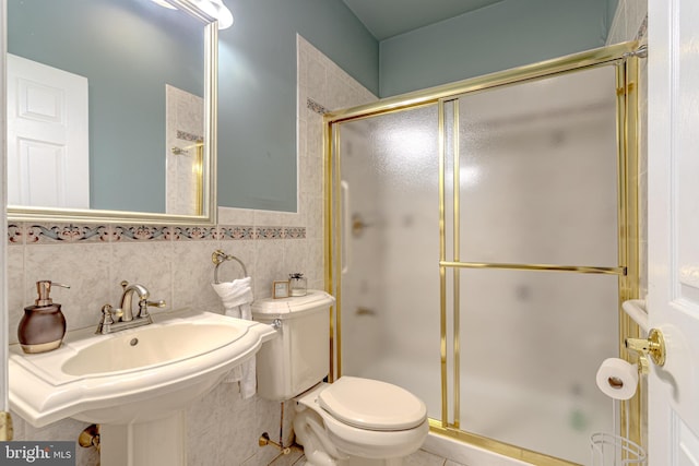 2 Wilderness Dr, Medford, NJ 08055 - bathroom featuring tile patterned flooring, wainscoting, toilet, tile walls, and a stall shower