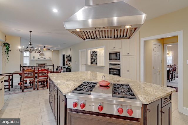 2 Wilderness Dr, Medford, NJ 08055 - kitchen featuring ceiling fan with notable chandelier, light stone counters, stainless steel appliances, and island range hood