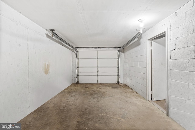 garage with concrete block wall