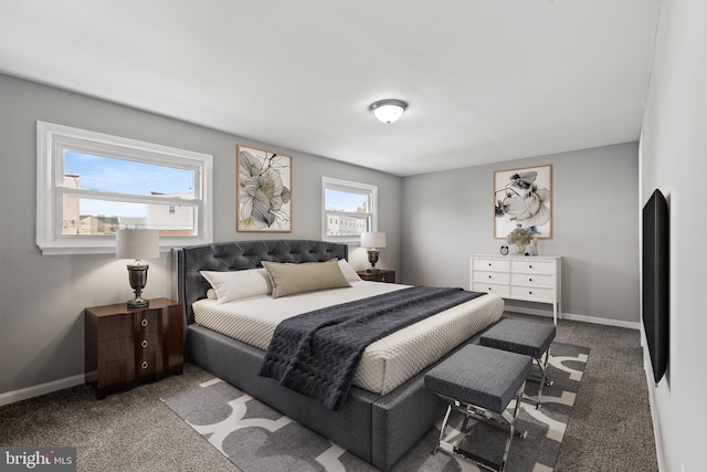 bedroom featuring carpet flooring and baseboards