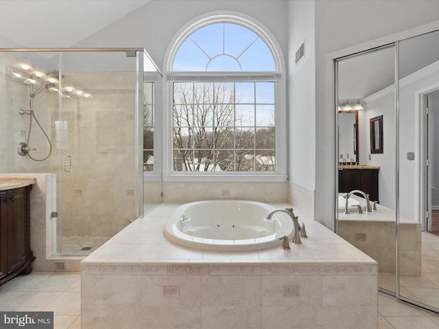 full bath with tile patterned floors, a shower stall, and vanity