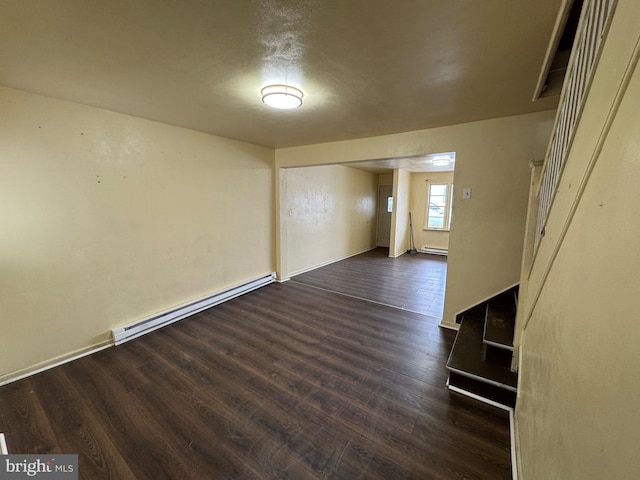 interior space with a baseboard radiator and dark wood-style flooring