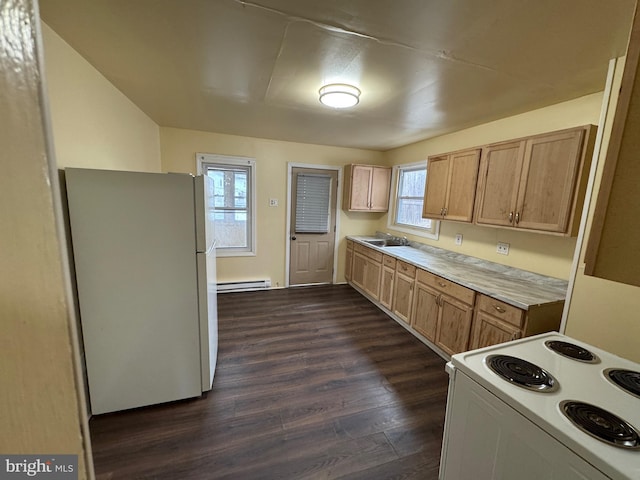 kitchen featuring dark wood-style floors, a baseboard radiator, light countertops, a sink, and white appliances