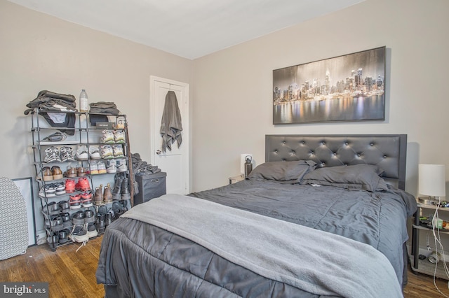 bedroom featuring wood finished floors