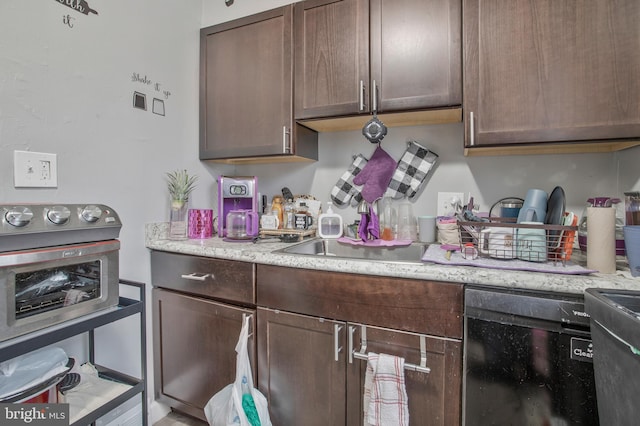 kitchen featuring wine cooler and dark brown cabinetry