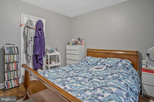 bedroom featuring wood finished floors