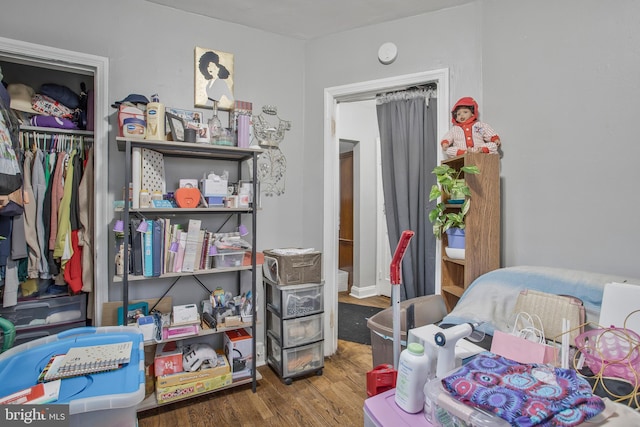 bedroom featuring a closet and wood finished floors