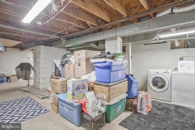 unfinished basement featuring separate washer and dryer