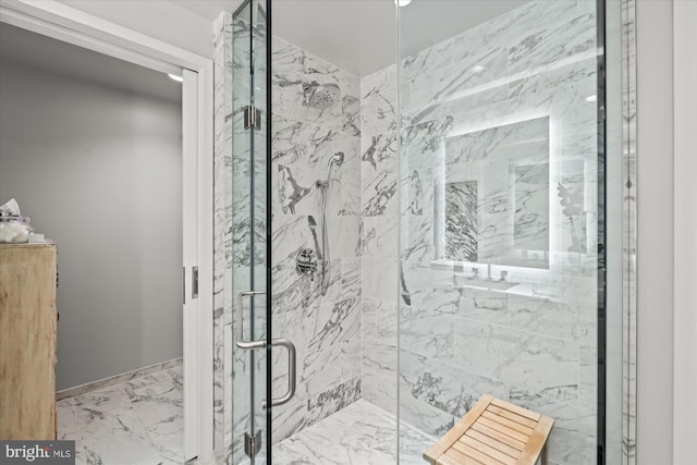 bathroom with marble finish floor and a marble finish shower