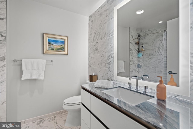 bathroom with toilet, recessed lighting, vanity, marble finish floor, and a shower