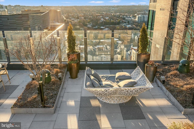 view of patio featuring a balcony