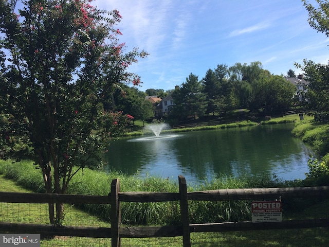 view of water feature with fence